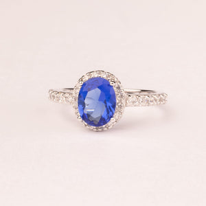 Oval sapphire zirconia ring with micro zirconia.