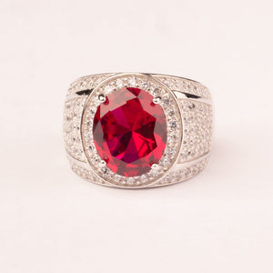 High mesh ring with central oval ruby zirconia