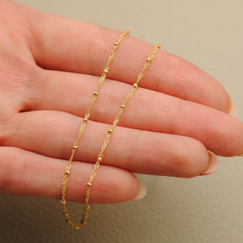 18K Solid Singapore Chain With Smooth Balls. Length 45 cm Width 1.2 mm