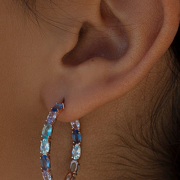 Earrings with colored stones in shades of blue and pink