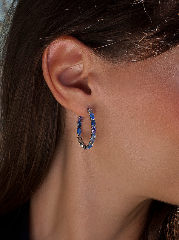 Hoop earrings with oval-cut stones in blue tones