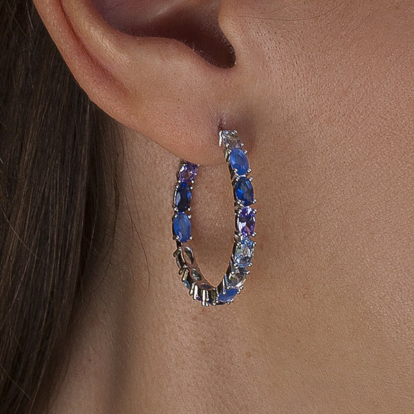 Hoop earrings with oval-cut stones in blue tones