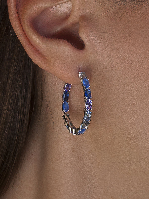 Hoop earrings with oval-cut stones in blue tones