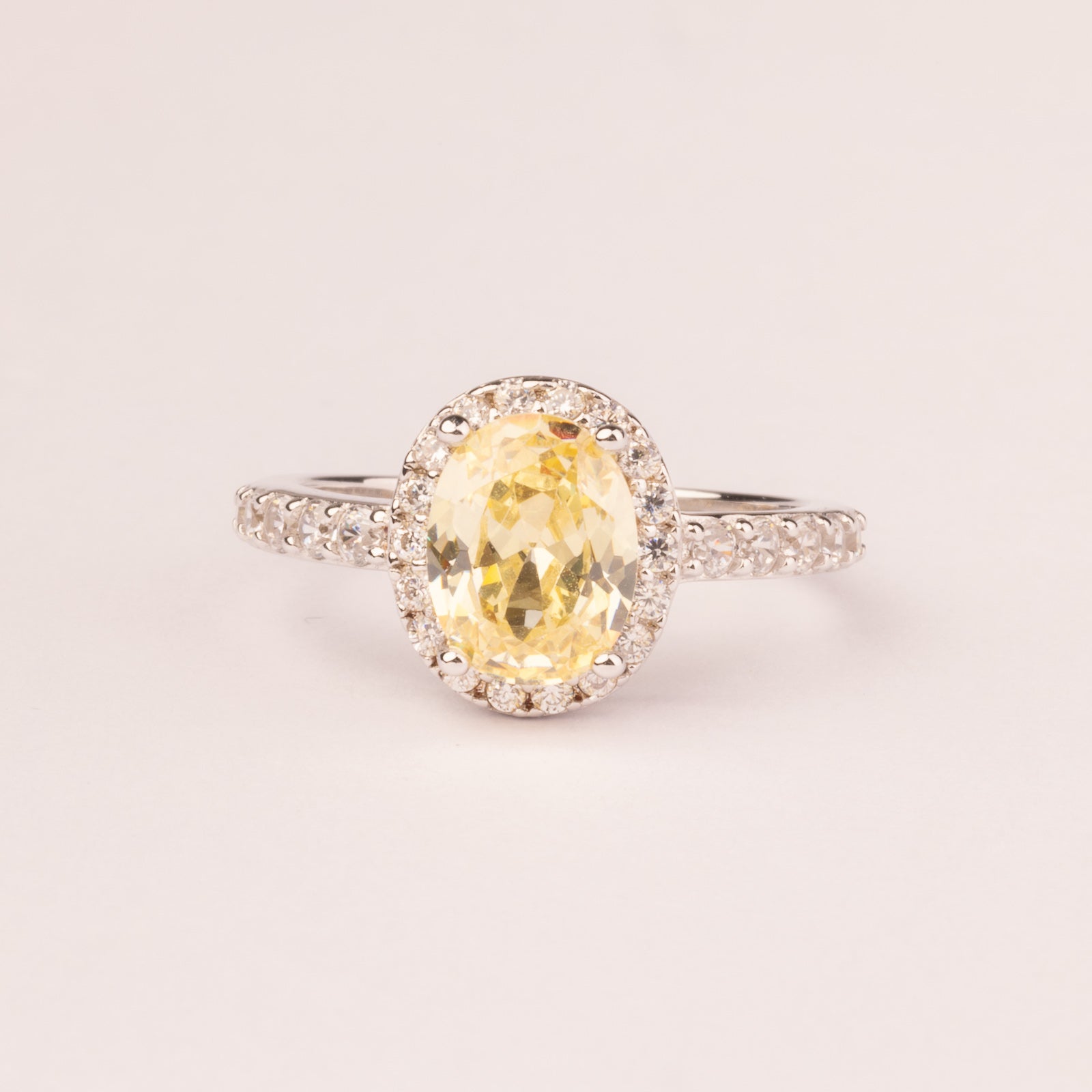 Oval topaz cubic zirconia ring with micro cubic zirconias.
