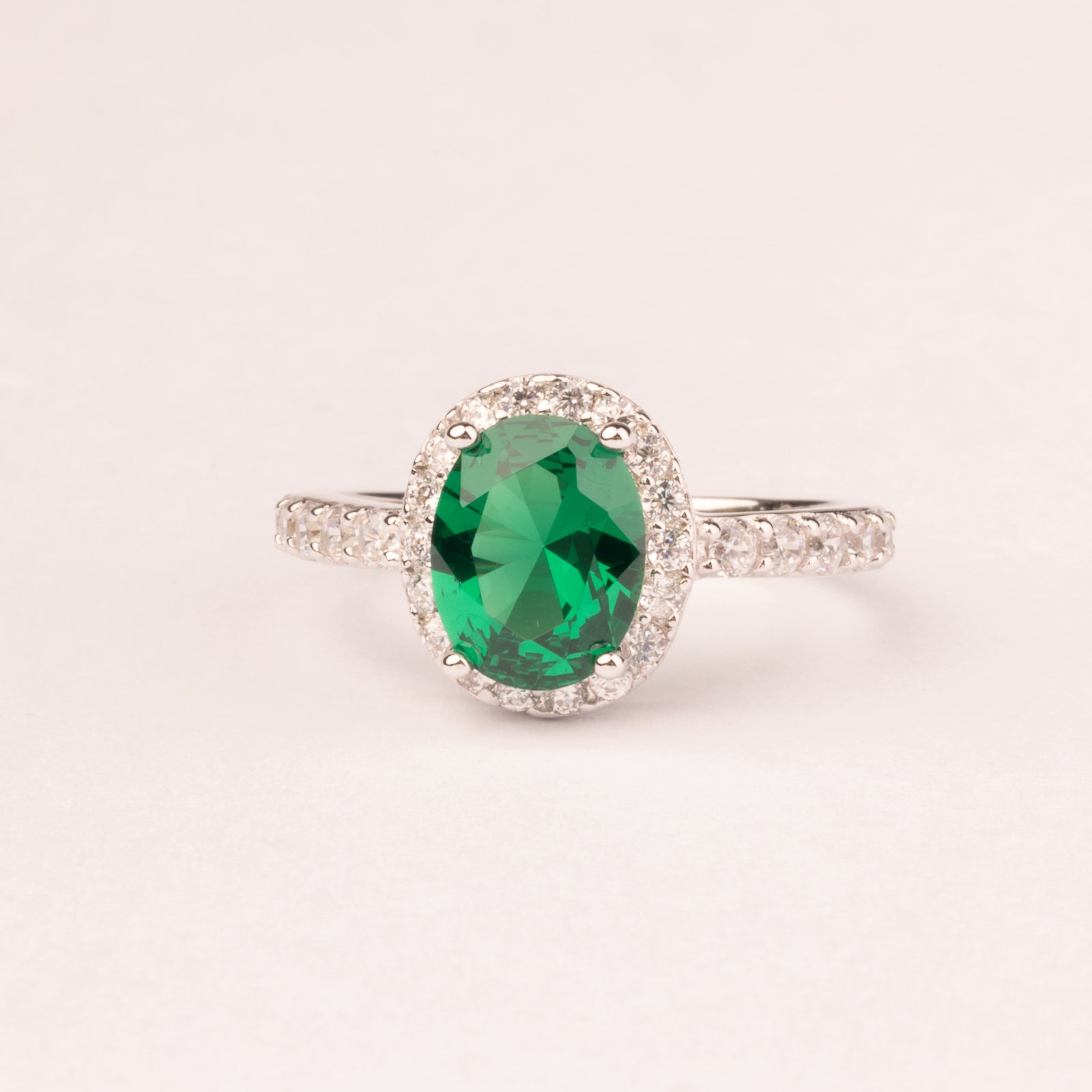 Oval emerald cubic zirconia ring with micro cubic zirconias.