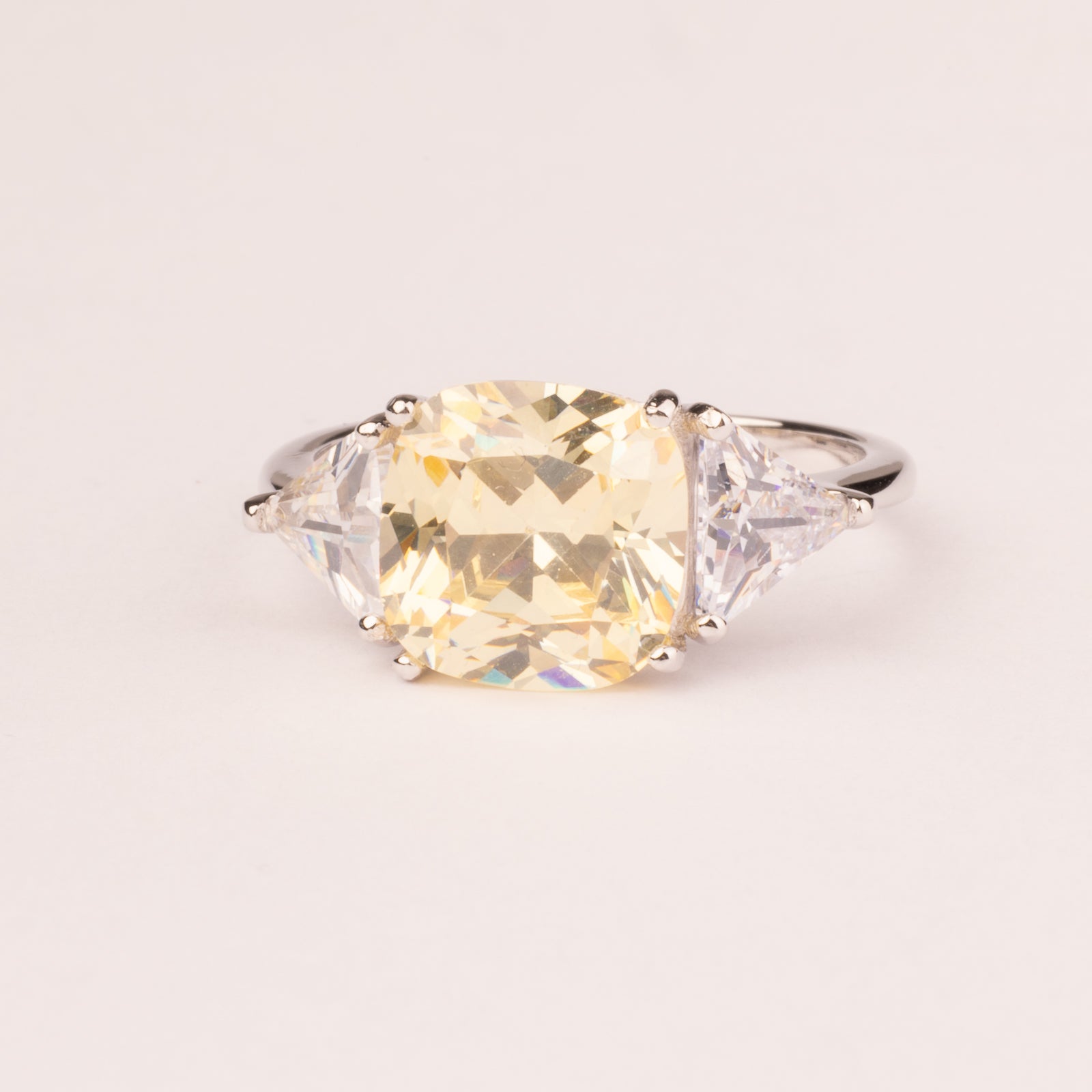 Square topaz ring with triangular zirconia
