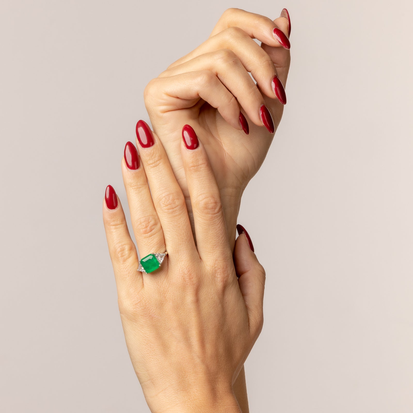 Square ruby ring with triangular cubic zirconia