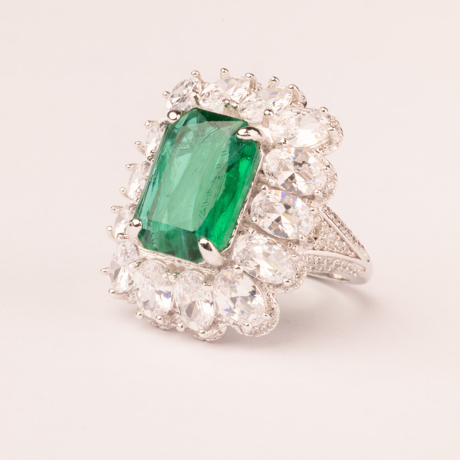 Emerald cut emerald stone ring and pavé