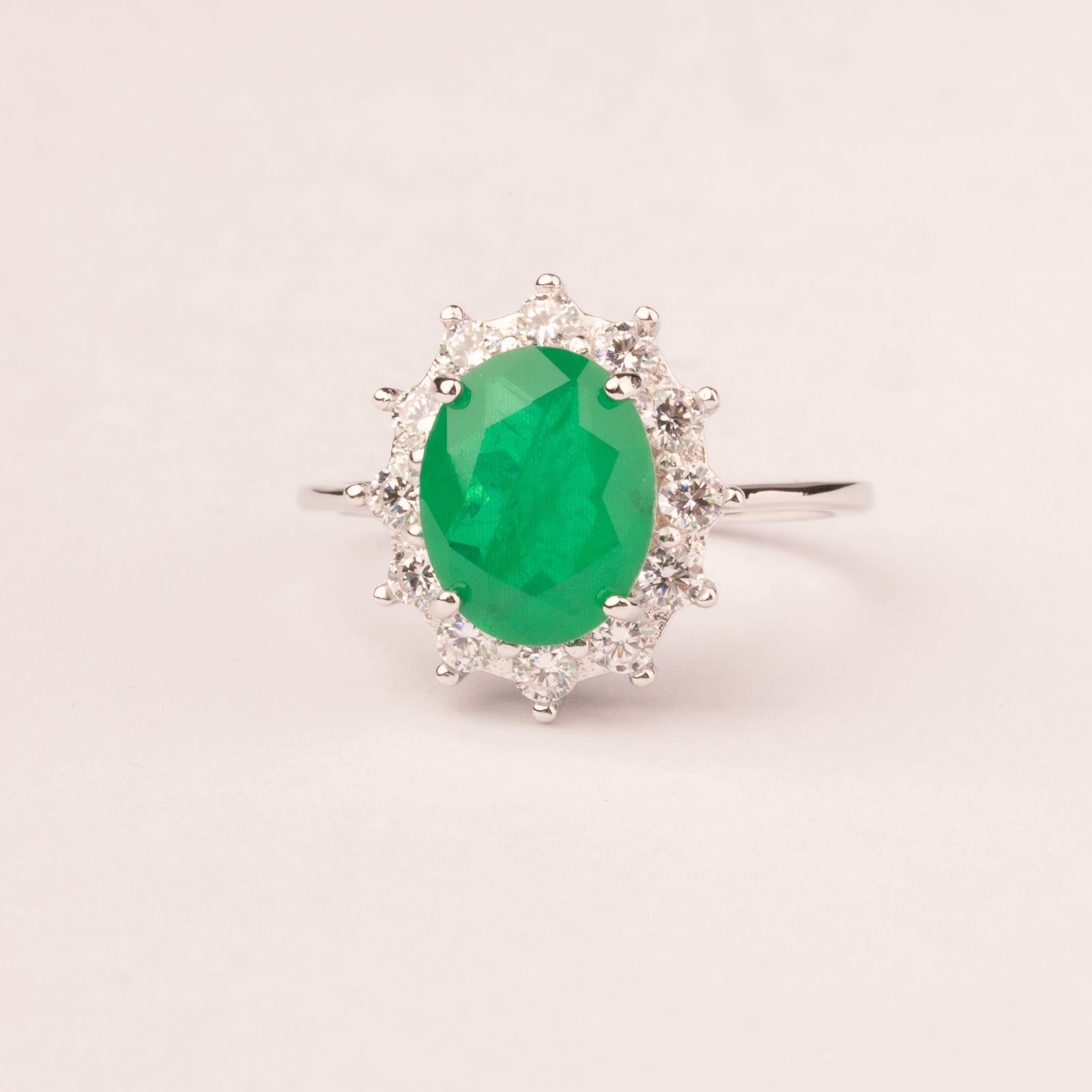 Oval emerald cubic zirconia ring with white cubic zirconia crown