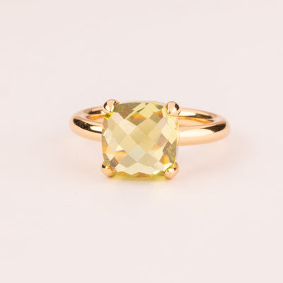 Colorful ring with cushion-cut peridot zircons