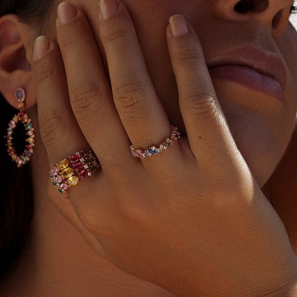 Ring with colored stones and arch in cool tones