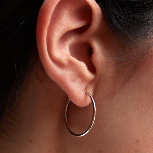 Small silver hoop earrings smooth tubular design 20 mm