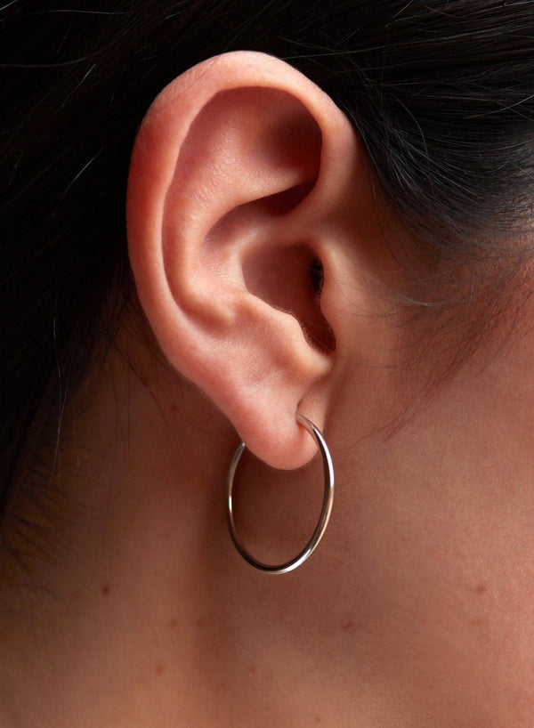 Small silver hoop earrings smooth tubular design 20 mm
