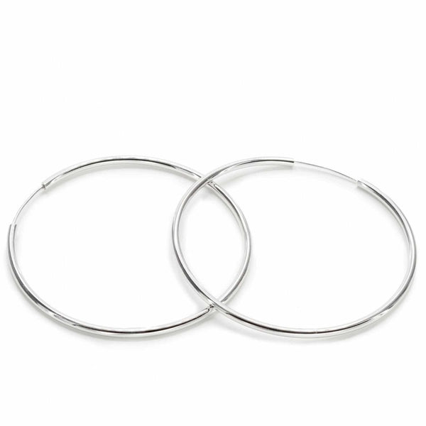 Large hoop earrings with smooth silver tubular design and hidden clasp 60 mm