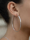 Large hoop earrings with smooth silver tubular design and hidden clasp 60 mm