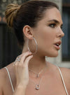 Large hoop earrings with smooth silver tubular design and hidden clasp 60 mm