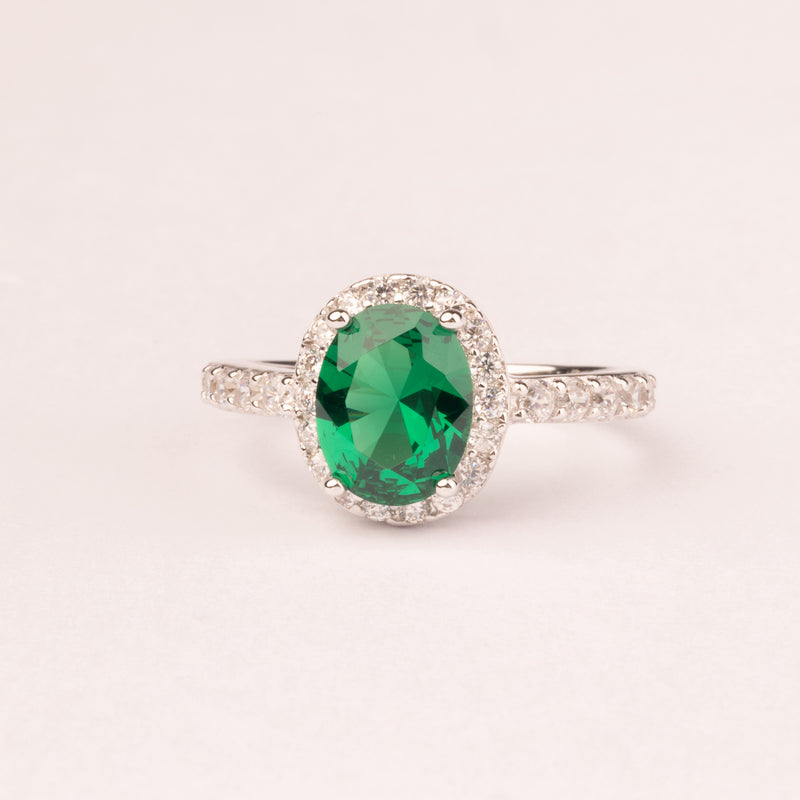 Oval emerald zirconia ring with micro zircons.