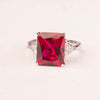 Ring with emerald cut ruby ​​zircons