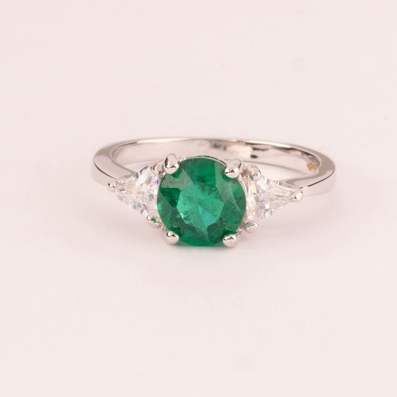 Round emerald ring with triangular zirconia