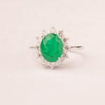 Oval emerald zirconia ring with white zirconia crown