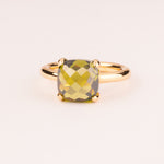 Colorful ring with olive green cushion-cut zircons