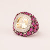 Pink rounded pavé ring with contrasting center stone