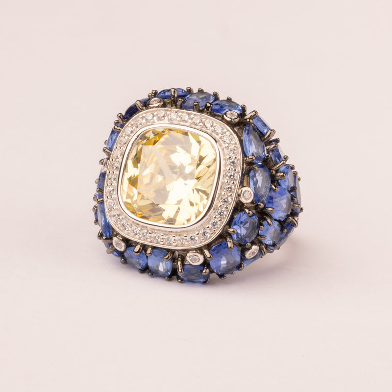 Rounded pavé sapphire ring with contrasting center stone