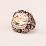 Topaz rounded pavé ring with contrasting center stone