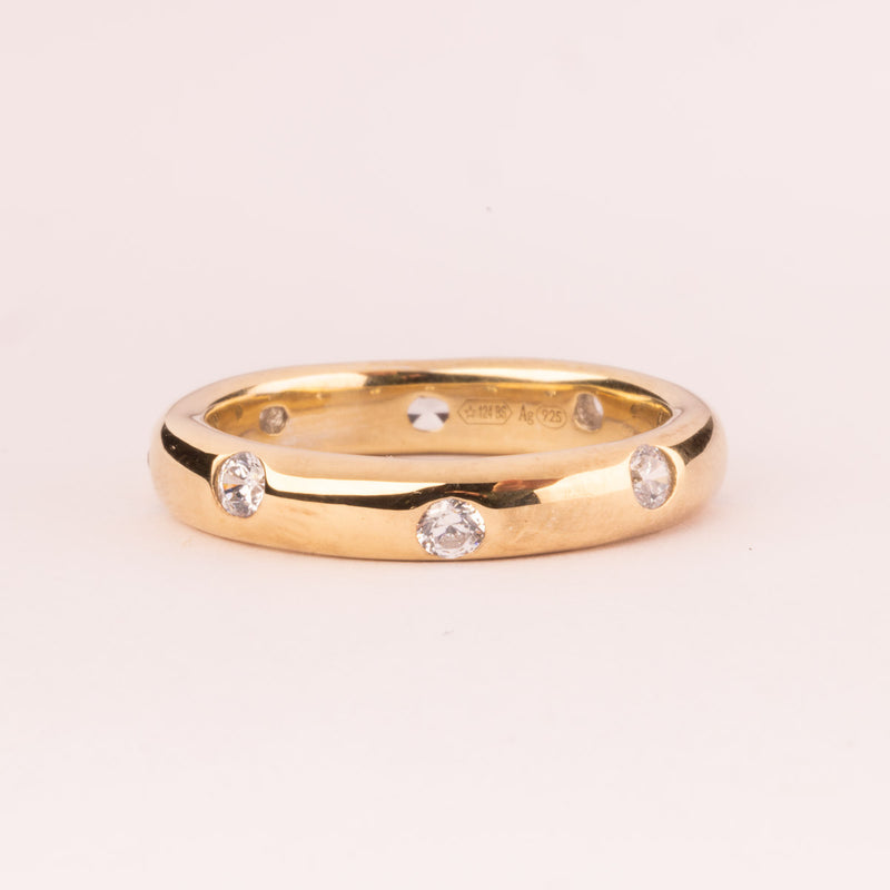 Smooth ring with white zircons plated in 18k gold