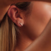Boucles d'oreilles créoles triple rangée avec zircons dorés