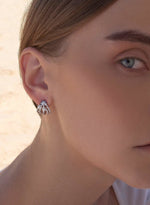 Original claw design earrings with zirconia rails