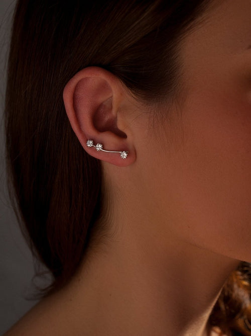 Silver climbing earrings with side star-cut zircon motif